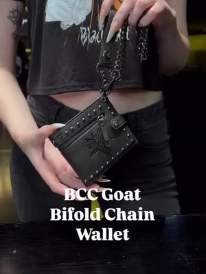 BCC GOAT BIFOLD CHAIN WALLET  Faux leather bifold wallet with 6 card slots and bill compartment. BCC goat logo embossed on front. 18” gunmetal finish chain that attaches to belt loop. Zipper, studs and chain in gunmetal finish. Dimensions: 8.5” L (when opened) x 3.75” H #blackcraftcult #blackcraft #wallet