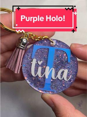 Make a keychain with me!! Purple Holographic!  #acrylickeychain #resinkeychain #acrylic #resin #resinpour #resinart #smallbusinessowner #supportsmallbusiness #SmallBusiness #smallbusinesscheck #like #tiktok #tiktokmademebuyit #tiktoktrending #trending #fyp #foryou #foryoupage #gold #holographic #white #purple #creative #create #art #artistsoftiktok #sparkle #sparkley #glitter #glitterkeychain #bellalofacreations