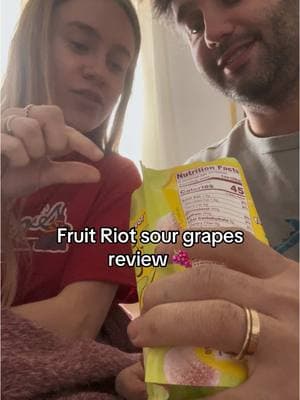 Fruit riot sour grapes review 🍇  Plead ignore the pile of underwear behind me we’re folding laundry LOL  #fruitriot #fruitriottastetesting #sourgrapes #candygrapes #review #pregnancycravings #pregnancy #pregnant #firsttrimester 