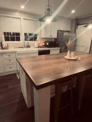 big throwback before fireplace/accentwall/fauxbeam/black wall by room, new fridge, I love all the projects we have done, it’s weird seeing it like this! 🖤🤍🤎 #Home#improvement#DIY#fauxbeam#fireplace#accentwall#upgrades#throwback#western#boho#neutrals#homeinspo#doublewide#claytonhomes