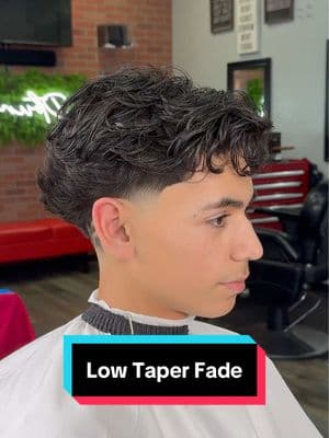 Low Taper Fade 😮‍💨 The low taper fade is perfect for this head shape. It allows for more darkness to show contrast to the fade. The blowout taper adds shape to the head. #iebarber #lowfade #midtaper #lowtaperfade #straighthair #dropfade #lowtaper