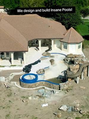 We design and build Insane Pools! Check out this incredible Insane Pool completed in Central Florida. This backyard features a massive grotto, infinity edge, spa, sun shelf, and a water slide. #insanepools #lucaslagoons #waterslide #backyardgoals 