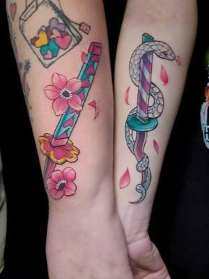 Demon Slayer sword hilts 🐍🌸 These were really fun to do 💗 #demonslayertattoo #coupletattoo #animetattoo #colortattoo #tattoo #orlandoflorida 