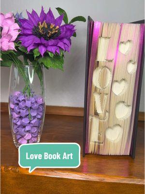 Love with hearts book folding art inside this beautiful book with purple iridescent pages. Let me know in the comments if you want to know where to purchase this. #bookart #bookfolding #bookfoldingart #valentinesdaygift 