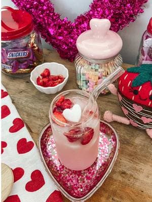 Recipe ⬇️🍓🩷 This is the perfect copy cat drink for a Valentine’s Day party! 💕🍓 A pink drink minus the caffeine is a fun treat for kids and tastes just like the Starbs version!  💗Pink Drink💗 Add ice to glass Fill glass 3/4 full with White Cranberry Strawberry Juice Add a splash of coconut milk Add frozen coconut milk ice cubes for fun Add freeze dried strawberries #pinkdrinkstarbucks #pinkdrinkathome #copycatpinkdrink #valentinesparty #valentinesfood #valentinedrink 