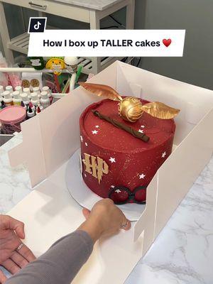 Great little hack if your cake boxes arent tall enough :) All of the cake boxes that i use are in my amazon storefront under "cake boxes" 🫶🏼 #caketok #bakerlife #cake #cakeboxes #redcake #fyp #harrypottertiktok #harrypotter 