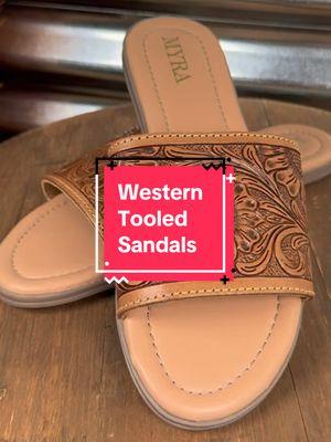 Sandals, but make them Western. 🤠✨ The Myra Bag Xena Hand Tooled Sandals are here to bring that cowgirl charm to your warm-weather wardrobe! 🌞 Hand-tooled leather with stunning detailing gives these sandals that one-of-a-kind look, making them perfect for dressing up or keeping it casual. Whether you're pairing them with your favorite denim, a flowy dress, or even shorts and a graphic tee, these beauties add the perfect finishing touch. 😍 Let’s talk comfort—because style is nothing without it! These sandals are designed for all-day wear, so whether you're strolling around town, hitting up a summer rodeo, or just enjoying the sunshine, your feet will thank you. ☀️ Plus, that hand-crafted detail? Chef’s kiss. 👌🏼 Western-inspired, effortlessly chic, and made to stand out—what more could a cowgirl ask for? If you love unique pieces that bring a little extra personality to your outfit, these are a must-have. Don’t wait, because once they’re gone… well, you know the deal. 😉 #TooledLeather #WesternSandals #CowgirlStyle #BroncoStyle #MyraBag #SummerVibes #TrendyCowgirl #WesternChic #SandalSeason #FashionWithAnEdge 