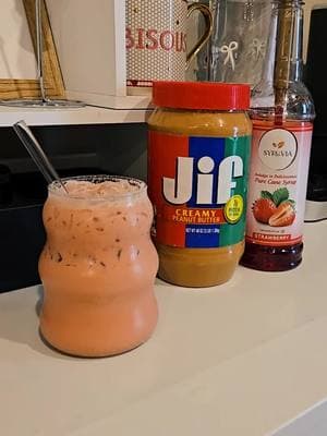 Peanut Butter and Jelly Breve ✨️ Wow! This combo is so good! You could do any fruity syrup you want too! Raspberry would probably be delicious too!  Recipe: Spoonful of Peanut Butter 2 shots of espresso (Arpeggio, Nespresso Original Line) 3 pumps of Strawberry Syrup (about .75 oz) @Syruvia  Half and Half #coffee #coffeeathome #pbandjlatte #breverecipe #ilovecoffee #starbucksathome #dutchathome #nespressorecipe 