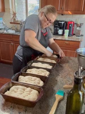 Recipe Below!⬇️  Here’s the recipe for my simple and cost efficient homemade bread recipe! 🍞 In the video I am punching down the dough and dividing the dough between the bread pans. You can eyeball the loaves but often I will weigh it out. I aim for 1.7 pounds or so of dough per pan.  Our family of ten eats a lot of bread and I save a lot of money making our own and also you just can’t beat the health benefits of homemade bread versus the highly processed store bought bread.  Mamaw’s Homemade Bread Ingredients:  3 cups lukewarm water 2 tbsp sugar or honey  2 tsp salt 2 tsp active dry or instant yeast 3 tbsp olive oil  6-8 cups all purpose flour, and more as needed to make a smooth dough  Directions:  In a large bowl put the water, sugar, and salt. Sprinkle the yeast on top. Add the oil and stir in 5 cups of flour until it becomes too hard to stir.  Now it’s time to knead! Flour your hands to help prevent the dough from sticking to them and continue adding the rest of the flour and kneading until a smooth elastic dough is formed. Test the dough by taking a bit of dough and rolling it between your hands. If it’s sticks to your fingers, add more flour. If it doesn’t stick but becomes smooth and elastic, you have enough flour. Knead for about 8-10 minutes.  Cover with a cloth and let rise for one hour or until doubled in size.  Oil hands and punch down dough. Pull dough away from the side of the bowl and oil the bowl as you make your way around the bowl. Work dough together and flip leaving it smooth on top. Cover with a cloth and let rise until doubled, about an hour.  Punch down the dough, divide it between two oiled loaf pans. Form the loaves and place in pans and cover with a cloth and let rise for 30 minutes or until doubled in size. Poke the loaf in a corner and if the indent springs back up then it needs to rise more, if it stays indented, it’s ready to bake. Bake at 375 degrees on the middle oven rack for 30-35 minutes or until lightly browned on top and bottom. Remove bread from pans and let loaves cool on a cloth.  Butter tops of warm loaves if desired.  Yield: 2 loaves  #homemadebread #yeast #sandwich#homebaker #dough #dailybread 