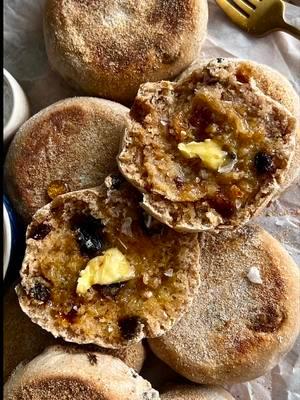 SOURDOUGH CINNAMON RAISIN ENGLISH MUFFINS Clouds of pure goodness ☁️ Recipe below OR go to my website through the link in my bio 🤎 #Recipe Details (makes 10): Sourdough Cinnamon Raisin English Muffins - 230g milk of choice, at room temperature - 205g active sourdough starter - 25g honey @Nature Nate’s  - 375g all-purpose flour @Bob’s Red Mill  - 8g salt - 5g cinnamon - 125g raisins - Cornmeal, for cooking/sprinkling For Serving: - Butter - Flaky sea salt  - Honey Instructions: 12 hours before you plan to make the dough, feed your starter (I like to do this the night before). Once your starter has doubled in size, make the dough. In a large bowl, whisk together the milk, active sourdough starter, and honey until well combined. Add in the flour, salt, and cinnamon, and mix together until a shaggy dough forms. Cover the bowl and let rest for 1 hour. While resting, fully submerge and soak the raisins in water.  After 1 hour, rinse and dry the raisins. Add the raisins to the bowl with the dough. Stretch and fold them into the dough until they are evenly dispersed and the dough is more smooth. Cover and rest for 1 more hour.  After 1 hour, perform one round of stretch and folds. Cover the dough and allow to bulk ferment on the counter for 5-6 hrs, or until just about doubled. Then, place the bowl into the fridge to cold ferment for 8-12 hrs or overnight (make sure the top of the bowl is completely covered to prevent the dough from drying out; you can use plastic wrap and then a kitchen towel). The next morning, prepare a large baking sheet with 10 squares of parchment paper. Sprinkle each square generously with cornmeal.  Remove the dough from the fridge and turn it out onto a clean countertop. Divide  into 10 pieces.  Use your hands to shape each piece of dough into a ball, using friction of the countertop to create tension & roll iinto rounds.  Place each ball onto a parchment paper square, and sprinkle the tops with a little more cornmeal. Cover and allow to proof in a warm environment for 4-5 hours, until doubled in size and puffy.  Once ready to bake, preheat the oven to 350F and heat a dry cast iron skillet or non-stick pan over medium heat.  Sprinkle the skillet with cornmeal. Working in batches, transfer the English muffins onto the hot skillet. Cook for 2-3 minutes per side, or until golden brown. Then, transfer back onto the baking sheet. Repeat with the remaining muffins. Bake at 350F for 10 minutes to finish cooking the interiors. Let cool slightly and serve warm with butter, flaky sea salt, and honey, if desired. Enjoy! @bloomsupps #bloompartner #sourdough #sourdoughrecipe #sourdoughbread #cinnamon #cinnamonraisin #englishmuffins #sourdoughenglishmuffins #sourdoughcinnamonraisinenglishmuffins #cinnamonraisinenglishmuffins #homemade #homemadeenglishmuffins #englishmuffinrecipe #sourdoughenglishmuffinrecipe #baking #sourdoughstarter #bread #snack #Breakfast #brunch #honey #butter #fluffyenglishmuffins #englishmuffinsfromscratch #sourdoughrecipe  @Lodge Cast Iron @Earlywood 