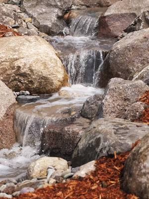 Whimsical Waterfalls 💦 #iowawaterscapes #justaddwateria #iowa #desmoines #waterfall #pond #outdoorliving #landscaping #waterscape #aquascape #fountain #koipond #waterfeature 