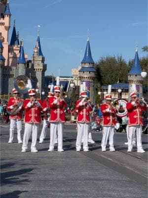 The Main Street Philharmonic marching through Magic Kingdom 🎶  #disneyparks #marchingband #waltdisneyworld #mainstreetusa #magickingdom #cinderellacastle 