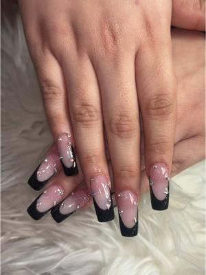 A little edge, a little glam—black French tips with rhinestones. #fyp #vhnailspa #vhnailspahouston #houstontx #blacknails #blackfrenchtipnails #rhinestones 