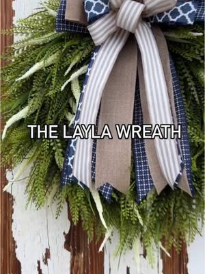 It’s been a while since I posted a ‘how I create it’ reel.  New to the shop just in time for spring! 🌿 Say hello to the Layla wreath, featuring a navy and tan bow and UV-protected greenery, perfect for transitioning into summer. The Layla Wreath, Now Available.  2 sizes available, beaded grass wreath perfect for your Spring and Summer porch decor.  #springwreath #springdecor #laylawreath #wreath #barrelofwreaths #homedecor #decor #farmhousewreath #doorwreath #frontdoorwreath #farmhousedecor #SmallBusiness