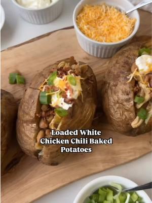 LOADED WHITE CHICKEN CHILI BAKED POTATOES 🥘🥔 #BushsBeansPartner The perfect weeknight dinner when you're craving comfort food but short on time. @Bush’s Beans Simmered White Chili Magic gives you rich, slow-cooked flavor in just minutes! INGREDIENTS: 4 baked potatoes 1 tbsp olive oil 1 small onion, diced 1 can @bushsbeans Slow-Simmered White Chili Magic 1 (4 oz) can diced green chilis 8 oz cooked chicken Toppings: sour cream, shredded cheese, bacon bits, green onions, or any other favorites INSTRUCTIONS: In a pot over medium heat, add olive oil and diced onions. Sauté until translucent, about 3 minutes.  Pour in @bushsbeans Slow-Simmered White Chili Magic (undrained), undrained diced green chilis, and cooked chicken. Stir to combine, cover, and simmer for 7-10 minutes Carefully cut open the baked potatoes, making sure not to cut all the way through. Gently press them open and fluff with a fork.  Spoon the white chicken chili over each potato and garnish with your favorite toppings #weeknightmeal #EasyRecipe #semihomemade #whitechickenchili #comfortfood #bakedpotato #loadedbakedpotato #chickenchili