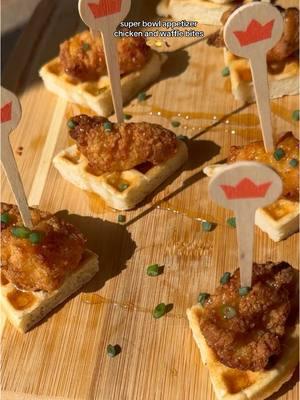 Chicken and waffle bites🧇🍯 Perfect appetizer for super bowl coming up and takes just 15 min to pull together!! ingredients  - waffles (frozen or homemade)  - chicken bites (I used perdue)  - maple syrup for brushing - hot honey for drizzle - chives for garnish  Start by air frying or baking your chicken bites. I used perdue but Just bare is a great brand to use as well.  While those are air fryer according to package instructions, you can make homemade waffles or you can buy frozen and start toasting them to your liking.  While waffles are being made, I made hot honey with just honey and hot sauce or you can buy something like Mike’s hot honey.  Once waffles are done,  cut them into 4 triangles. Then brush maple syrup onto each waffle piece. Then when the chicken bites are done, place them on top of each of the waffle pieces.  Then drizzle hot honey on top each of the chicken and waffle bites. Then garnish with chopped chives and place a toothpick of some sort to hold them together.  Then enjoy this super easy appetizer! #superbowlappetizers #chickenandwaffles #superbowlsnacks #superbowlparty #superbowlpartyfood #footballsundayappetizer #15minappetizers #easyappetizers #partyappetizers 