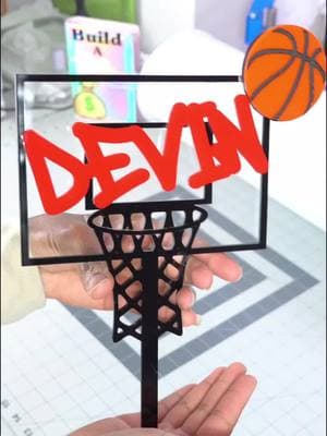 Come pack this custom basketball cake topper featuring a number 15 cake charm each item is layer acrylic 🎂 This beauty is made from high-quality 3mm acrylic, double-layered add to about 6-9mm thick acrylic 👌🏽 for celebrating that special 15th birthday! 📦 Ready to pack and ship! #CustomCakeTopper #BasketballTheme #AcrylicArt #BirthdayCelebration #SmallBusiness  #ajuniquecreationsllc #lasercutting  #ajuniquecreationsllc #CakeDecor #BirthdayCelebration #caketopper  #Handmade #UniqueGifts #CakeDecor #15thBirthday #AcrylicDesign