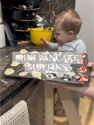 MINI PANCAKE MUFFINS!! 🥞 Recipe: 2 cups pancake mix 1 1/2 cup water  (I added a little vanilla and syrup  to the batter) - mix all together and divide evenly into mini muffin pan  - add whatever toppings you prefer ( we did strawberries, blueberries, sprinkles and bananas)  -bake at 375 for about 7-10 mins or until edges are golden brown  THATS IT. Super easy but makes for a fun activity with your little one!! 🫶🏻 #toddlermeal #toddlerfood #toddlerfoodidea #cookingwithtoddlers #mom #momlife #toddlermom #minipancakemuffins #pancakemuffins #mealideas #breakfastideas #babymealideas #blw 