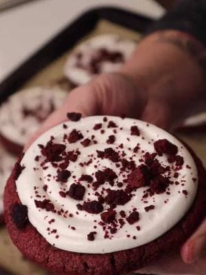 Red Velvet Crumbl Style Cookies! Ingredients: 2 packs Red Velvet Cookie Mix (Dollar Tree) 1 stick margarine or butter softened  1 egg or 1/4 cup unsweetened applesauce 1 8 ounce can of cream cheese frosting 1/2 jar marshmallow fluff Mix cookie mix with margarine and egg (or applesauce) and chill for at least 1 hour. Scoop into 8 large cookies and bake at 350 degrees for 18 minutes.  Let cool completely. Mix cream cheese frosting with marshamllow fluff for a glossy bright white frosting Crush one cookie to make red velvet crumbles. Frost the cookies and top with crumbles, enjoy! #redvelvetcookie #crumblcookiesoftheweek #valentinesdaytreats #budgetbaking #easybaking #dollartreefinds #cheapandeasyrecipes #crumblathome #dollartreedinners