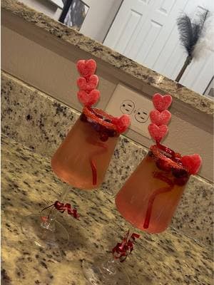 Another Valentine Day Mocktail 💗  Ingredients 💗💗 - Red Edible Glitter (Use Lime To Allow Glitter To Stick) - Ice -Cranberries  - Cranberry Juice - Pink Lemonade  -Poppi (Strawberry Lemon) - Valentine Gummy Candy (of you choice)  #valentines #ValentinesDay #mocktail #valentinesdayideas #valentinesdrink #hoildaydrinks #fyp #fyppppppppppppppppppppppp 