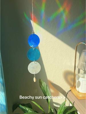 Who is ready for summer?!! ✨🪩🌊 #suncatcher #comingsoon #blue #cowrieshell #beachy #rainbow #earthy #Summer #groundhogday 