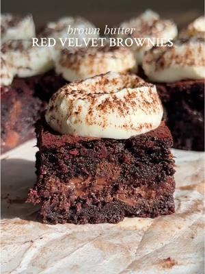 BROWN BUTTER RED VELVET BROWNIES I will always love these 🥹 Recipe below OR go to my website through the link in my bio 💌 #Recipe Details (makes 16): Brown Butter Red Velvet Brownies: - 1 cup (226g) salted butter - 1/2 cup (60g) unsweetened cocoa powder @Hershey’s  - 6oz dark chocolate chips @Ghirardelli Chocolate Company  - 2 tbsp (23g) olive oil @Graza  - 1 tbsp all-natural red food coloring - 3/4 cup (180g) brown sugar - 3/4 cup (175g) granulated sugar - 3 eggs, at room temperature  - 1 1/2 tsp (6g) vanilla extract - 1/2 cup (75g) all-purpose flour @Bob’s Red Mill  - 1/2 tsp (3g) salt - 3/4 cup (165g) chocolate chips of choice @Nestle Toll House @Nestlé @Nestlé USA  Whipped Cream Cheese Topping: - 8oz (1 block) cream cheese @Philly Cream Cheese  - 1 3/4 cups (413ml) heavy cream - 1/2 cup (65g) powdered sugar - 1 tsp (4g) vanilla extract - Cocoa powder, for dusting Instructions: Preheat the oven to 350F. Grease and line an 8x8” square baking pan with parchment paper, leaving some hanging over the sides. Set aside. Start by browning the butter and preparing the chocolate mixture. Add the butter to a saucepan over medium-high heat. Allow to melt, foam up, and slightly brown (~5 minutes). Once golden brown, remove from the heat and immediately add the cocoa powder. QUICKLY stir to combine. Then, add in the chocolate chips and olive oil, and quickly mix until the chocolate chips are melted, and the mixture is smooth. Mix in the red food coloring and set aside to cool. In a large bowl, whisk together both sugars and the eggs. Whisk fast, until the sugar is dissolved and the mixture is frothy. Then, whisk in the vanilla. Once the chocolate mixture is cooled (it’s fine if it’s still a little warm), stream it into the egg/sugar mixture as you continuously whisk to combine. Fold in flour and salt. Then, fold in the chocolate chips (make sure the batter isn’t too warm before adding them). Evenly spread the batter into the prepared pan. Bake at 350F for 40-45 minutes, until the edges are set, the top looks slightly cracked, and the center is slightly soft. Let cool completely before slicing and topping with the cream. While cooling, prepare the whipped cream cheese topping. Place your mixing bowl in the freezer or fridge 5-10 minutes before starting. Beat the cream cheese on medium-high speed for 2-3 minutes until cream cheese is smooth and free of lumps.  Slowly pour in the heavy whipping cream and continue beating until the cream cheese resembles a liquid mixture. Continue to add the remaining heavy whipping cream and beat until soft peaks form. Add the powdered sugar and vanilla extract and beat until stiff peaks form. Use immediately and keep refrigerated. Top the cooled brownies with the whipped cream cheese topping, then dust with cocoa powder. Cut and serve. Enjoy! #brownbutter #redvelvet #brownies #redvelvetbrownies #brownbutterredvelvetbrownies #chocolate #fudgybrownies #richbrownies #chocolatechip #chocolatechips #darkchocolate #ValentinesDay #valentinesdaydessert #valentinesdayrecipe #valentinesdayrecipes #valentinesdaybaking #baking #dessert #brownie #brownierecipe #homemade #homemadebrownies #browniesfromscratch #creamcheese #whippedcream #whippedcreamcheesetopping @From Our Place @Earlywood @USA Pan 