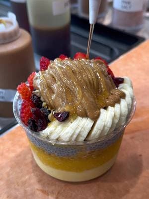 Brighten your day with our Signature Sunshine Bowl! ☀️🥭 A tropical blend of mango & passionfruit, topped your way. Drop by or click the link in our bio for delivery!  #islandbodega #mangomango #acaibowl #blueberries #bananas #fruitarian #healthyeatinglifestyle #chiapudding #chía #strawberrys #raisin #coconutflakes #cerritos