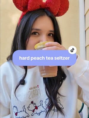 brewery x does it again! 🤭🍑 a nice options if you’re not in the mood for a 10%! 🍑 hard peach tea seltzer   📍 paradise garden grill 💲 13.50 #disney #disneyland #disneycaliforniaadventure #disneyparks #disneyfoodie #disneyfood #disneydrinks  