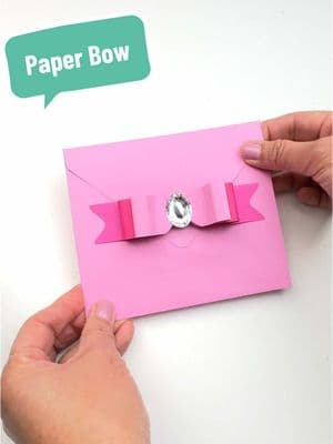 Visit me on IG for measurements and supplies used to make these adorable bows (using an envelope maker)🎀.  #makersoftiktok #crafting #papercrafts #crafts #craftideas #stationery #diycraft #paper #bows #papercraft #diycrafts #cardstock #easycraft #greetingcard #craft #tiktokcrafts #crafttok #craftsoftiktok #valentines #ValentinesDay #greetingcards 