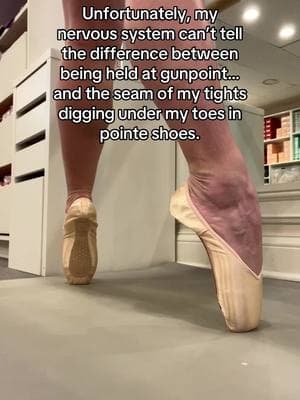 Unfortunately, my nervous system can’t tell the difference between being held at gunpoint… and the seam of my tights digging under my toes in pointe shoes. 🫠🩰💀 #PointeShoeProblems #BalletLife #DancerStruggles #PointePain #BalletHumor #BallerinaLife