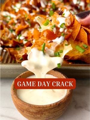 GAME DAY CRACK. People go crazy for it! #ad Sweet potato chips smothered with melty white cheddar, Buffalo chicken, smoky bacon, and @Ken’s Steak House Dressings creamy ranch sauce, it’s crispy, cheesy, and SO EASY. SEND to the friend who’s hosting the game watch to give them a **hint**! YOU’LL NEED: -1 (5 oz) bag sweet potato chips -1 (8 oz) block sharp white cheddar cheese, shredded -1 c cooked, shredded chicken -3 T Sweet Baby Ray’s Buffalo Sauce -1/4 c, plus 1 T Ken’s Ranch Dressing, divided, plus extra for dipping -6 strips cooked bacon, chopped -1 tsp milk -Thinly sliced chives or green onions, for garnish Spread the chips onto a baking sheet, slightly overlapping them. Sprinkle generously with the cheddar. Stir together the chicken, buffalo sauce, and 1 T of ranch. Sprinkle it over the cheese. Add chopped bacon on top, then bake at 425°F until the cheese is hot and melty, about 5 minutes. In a separate bowl, stir together 1/4 c ranch with 1 tsp milk to make it drizzleable. Drizzle the ranch sauce over the baked chips, sprinkle with chives, and serve hot with extra ranch for dipping. Full step-by-step recipe at wellplated.com and at the link in my @wellplated bio! #kenspartner#ranchlover #gamedayfood #appetizerrecipes #buffalochicken #sweetpotatochips #EasyRecipes #footballfood #cheesyrecipes #crispyandcreamy #wellplated #gamedaycrack #biggame #biggamecrack #gamedayfood 