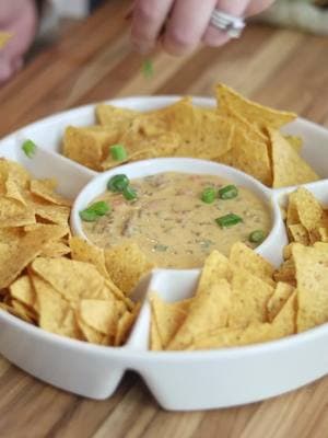 This queso dip is so good! An easy crockpot appetizer, great football food ❤️ ✨ INGREDIENTS ✨ * 1 block of velveeta cheese * 3 roma tomatoes * 1 packet of taco seasoning * 1/4 Cup chopped green onions * 3 oz. diced green chilies * 1 pound hamburger (browned on the stovetop) * 1 Cup milk ✨INSTRUCTIONS ✨  1. Place block of Velveeta cheese in the bottom of a crockpot and add milk 2. Cook on high heat until it is completely melted stirring occasionally 3. While the cheese is melting brown the hamburger meat on the stovetop and add the seasoning to it 4. Drain the seasoned hamburger meat and add it to the melted cheese 5. Add the rest of the ingredients to the melted cheese and stir together 6. Simmer on low heat setting until you are ready to serve it 7. Serve with your favorite chips and Enjoy! #crockpotdip #quesodip #superbowlfood #superbowlrecipes #easyappetizers  #EasyRecipes 