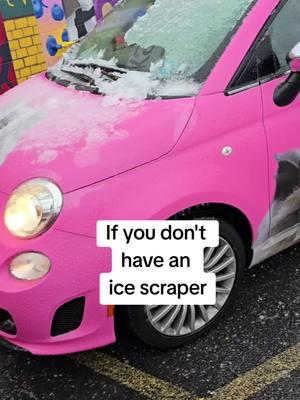 If you don't have an ice scraper handy, an upside-down plastic cup can clean your windshield just as well. #MacGyver #SnowDay #IceStorm #PinkFiat #CatCar #Fiat500 #CatBookstore  #IndieBookstore  #BooksMural #FiatUSA #IceScraper #PlasticCup #Haring