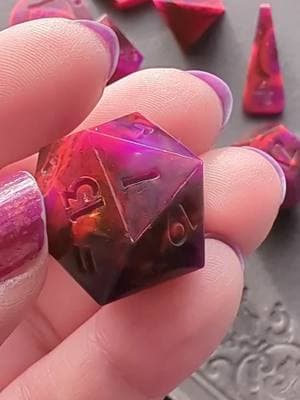 Rakshasa in motion! The neon pigments are hard to accurately capture with my phone - swirls of glittery black, neon purple, and dark neon pink! Watch to the end to see the neon vibin'! #handmadedice #dicegoblin #dnddice #ttrpgdice #dungeonsanddragons #dice #dnd #ttrpg #dndtiktok #ttrpgtok 