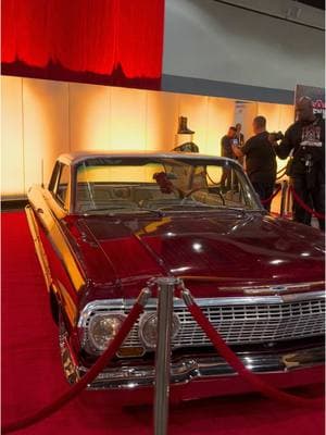 The lowrider displayed at Wrestlemania 39 superstore as a tribute to Eddie Guerrero along with the Wrestlemania 21 sign that says Wrestlemania goes Hollywood #WWE #eddieguerrero #vivalaraza #wrestlemania39 #wrestlemania21 #latinoheat 