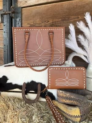 Look at this gorgeous boot stitched tote and organizer wallet! 🌵 #rodeofashion #rodeooutfit #rodeostyle #rodeochic #rodeoboutique #cowgirlstyle #cowgirloutfit #cowgirlfashion #cowgirlchic #heelsnspurs #heelsnspursboutique #boutique #southwesternstyle #southweststyle #yeehaw #punchy #cowgirlstyle #westernfashion #westernwear #westernstyle #boutiquestyle