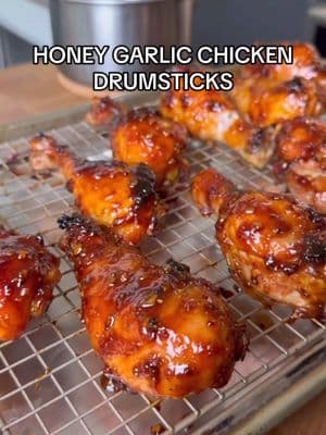 HONEY GARLIC CHICKEN DRUMSTICKS✨ this easy, delicious recipe is the perfect thing to bring to a Super Bowl party. Our chicken drumsticks get marinaded in a sweet and savory sauce, baked, and then basted to perfection—the end result being juicy, finger linkin' chicken that will be the first thing to go at the party!  Ingredients: 1/2 cup honey  1/4 cup avocado oil 1/4 cup tamari 5 cloves of garlic, minced 2 tablespoons fresh ginger, grated  3 tablespoons apple cider vinegar  2 tablespoons sriracha (optional) 1 teaspoon garlic powder  1/2 teaspoon black pepper  2 1/2 - 3 pounds chicken drumsticks  Instructions:  Make the marinade by adding the honey, avocado oil, tamari, garlic, ginger, vinegar, sriracha, garlic powder and black pepper to a glass measuring cup or small bowl and stirring to combine.  Add the chicken to a gallon-sized plastic bag and pour the marinade over top, massaging it into the chicken until it's evenly coated. Marinate in the refrigerator for an hour or up to overnight.  Preheat oven to 400F. Line a sheet pan with tin foil or parchment paper and place a wire rack on top of the baking sheet. (Note: if you don't have a wire rack that fits on your baking sheet you can skip that step, though it is preferable.) Remove the chicken from the marinade and place it on the wire rack, reserving the marinade. Bake the chicken for 30 minutes.  While the chicken cooks, add the marinade to a small saucepan and bring to a boil. Allow to slow boil for 15 minutes until thickened.  Remove the chicken from the oven. Baste the chicken with marinade and return to the oven. Bake for another 15 minutes.  Remove from the oven, serve with any remaining sauce, and enjoy!  Follow for more simple, healthy recipes!. . . #honeygarlicchicken #superbowlrecipes #superbowlfood #chickendrumsticks #drumsticksrecipe #marinaderecipe #chickenmarinade #footballfood 