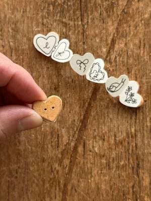 tiny heart button notebooks ✨ made with avocado pit buttons. Same deal as my original button books with an accordion fold for the inside papers. #DIY #avocadobutton #upcycledcrafts #fairynotebook #diynotebook #mininotebook #cottagecore #fairycore 