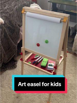 Keep the kids entertained with this little art easel. It’s got a chalk board, white board and a drop down paper canvas. #easel #littleartist #drawing #coloring #painting #artist