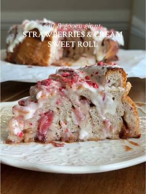 GIANT STRAWBERRIES & CREAM SWEET ROLL The way it looks like a rose too 🥹 Recipe below OR go to my website through the link in my bio 💌 #Recipe Details (serves 8-12): Strawberry Sweet Roll Dough: - 3/4 cup (177ml) warm milk of choice (~110F) - 2 1/2 tsp (8g) instant or active dry yeast @redstaryeast  - 1 egg, at room temperature  - 1/3 cup (76g) salted butter, very softened (almost melted) - 1/4 cup (50g) granulated sugar, divided  - 2 1/2 cups (390g) bread flour @King Arthur Baking  - 1/2 (3g) tsp salt - 1oz freeze-dried strawberries, crushed Filling: - 3/4 cup (255g) strawberry jam of choice - 1 cup (166g) chopped fresh strawberries @Driscoll’s  - 1/3 cup (78ml) heavy cream, for pouring over Cream Cheese Icing: - 6oz cream cheese, softened @Philly Cream Cheese  - 1/3 cup (76g) salted butter, softened - 1 1/2 cups (195g) powdered sugar - 2 tsp (8g) vanilla extract - Optional: additional freeze-dried strawberries, for garnishing  Instructions: Start by preparing the sweet roll dough and activating the yeast. Pour the warm milk into a large bowl or the bowl of a stand mixer. Add 1 tbsp (12.5g) of the granulated sugar and sprinkle the yeast overtop. Stir and allow to sit for 3-5 minutes, until frothy.  Then, add the egg, butter, and the rest of the sugar. Mix until combined.  Add in the flour, salt, and crushed freeze-dried strawberries, and mix or knead with your hands until barely combined (or use the dough hook attachment on the stand mixer). Allow to rest for 5 minutes so the flour can soak up the liquids.  Then, pour the dough mixture onto a floured surface and knead with your hands (or stand mixer) for 5-7 minutes, until elastic and smooth.  Place the dough into a lightly greased large bowl. Cover and allow to rise in a warm environment for 30 minutes, or until doubled in size.  Grease a 9” round springform or cake pan with butter. Once doubled, turn the dough onto a floured surface. Use a rolling pin to roll the dough out into a 15x12” rectangle. Evenly spread the strawberry jam across the entire surface of the dough. Then, evenly sprinkle the chopped strawberries all over the top of the jam. Assemble. Using a very sharp knife or pizza cutter, cut the dough into 6, 2” wide strips. Roll up one strip and place it in the center of the pan. Coil the remaining 5 strips around the center roll, starting each strip at the end of the previous one. Loosely cover the pan with plastic wrap and allow to proof in a warm environment for 45 minutes, until puffy and risen. Preheat the oven to 350F. Warm the heavy cream and pour over the sweet roll. Bake at 350F for 30-35 minutes, until golden brown. Remove and cool in the pan for 10 minutes.  While cooling, make the icing by beating together all of the ingredients in a medium bowl, until smooth.  Spread the icing all over the sweet roll and garnish with additional crushed freeze-dried strawberries, if desired. Slice and serve warm. Enjoy! #strawberries #strawberry #strawberriesandcream #sweetroll #giantsweetroll #giantstrawberriesandcreamsweetroll #sweetrollrecipe #strawberrysweetrolls #homemade #homemadesweetrolls #sweetrolls #baking #creamcheese #creamcheeseicing #strawberryjam #valentines #ValentinesDay #valentinesdayrecipe #valentinesdaydessert #valentinesdaybreakfast #valentinesdaybrunch #valentinesdaybaking #Breakfast #brunch #dessert #baking @Nordic Ware 