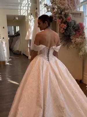 This stunningly full ballgown features textured jacquard fabric, an exposed boning corset bodice, and delicate corset-laced back — what do you love about her? GOWN: "Alivia"  #2025bride #2026bride #weddingdressinspiration #ballgown #ballgownweddingdress #corset #corsetdress #jacquarddress #weddingplanning 