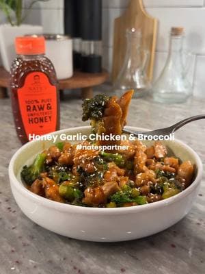 Honey garlic chicken is a staple in my household and using @Nature Nate’s makes it even better! #natespartner Be sure to grab your 100% honey from Amazon!  1/2 lb diced chicken thighs 1/2 lb broccoli florets  1/4 cup Nate’s 100% Honey 1/4 cup low sodium soy sauce 1/8 cup water 2 tbsp cornstarch 1 tbsp garlic paste  1 tbsp soy sauce  2 tbsp olive oil 1 tbsp soy sauce  1 tsp sesame seeds 1 tsp garlic powder  1 tsp onion powder  1/2 tsp white pepper  Instructions ﻿﻿﻿1. Cut chicken thighs into bite-sized pieces. Season with garlic powder, onion powder, white pepper, 1 tbsp soy sauce, and 1 tbsp cornstarch. Mix to combine. ﻿﻿﻿2. Heat olive oil in a pan over medium-high heat. Cook chicken thighs for 7-8 minutes until browned and cooked through. ﻿﻿﻿3. In a separate pan, steam broccoli for 5 minutes or until fork-tender, then drain. ﻿﻿﻿4. Prepare the sauce by whisking together honey, low-sodium soy sauce, water, 1 tbsp cornstarch, and garlic paste until smooth. ﻿﻿﻿5. Add broccoli to the pan with the chicken, then pour in the sauce. Stir to combine. ﻿﻿﻿6. Bring everything to a low simmer and cook for 5-7 minutes until the sauce thickens. ﻿﻿﻿7. Sprinkle with sesame seeds and serve hot. #nates #naturenates #honeygarlicchicken 