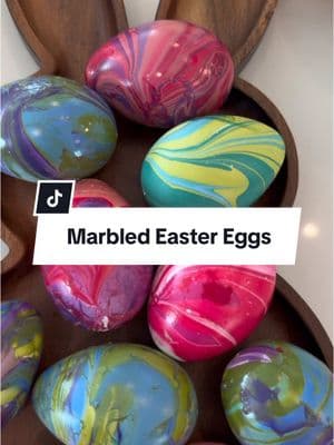 DIY Marble Easter Eggs!! These are so fun to make! I used plastic eggs and poked a tiny hole through the bottom with a toothpick! Then pour some water in a bowl and drip some nail polishes into the water, swirl with a toothpick and dip your eggs in! #easter #easterdiy #diyeaster #eastercraft #eastereggs #easteregg #easteriscoming #DIY #diycrafts #diycraft 