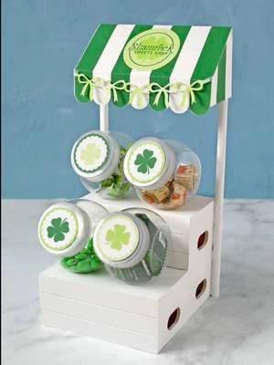 ☘️ SHAMROCK SWEETS SHOP ☘️ You all loved Cupid’s Candy Shoppe so much that I decided to keep the fun rolling and make a printable awning for St. Patrick’s Day too!  The base of this craft is all stuff you can buy at Dollar Tree and then you just need my printables to make it into a darling candy display.  They’re free and available as SVG files to cut by machine or PDF files to cut by hand. 👉 LINK IN PROFILE 👈 I think I’ll make an Easter version next. 🐇 What would you name it? Taking suggestions! 🤗 #stpatricksdaydecor #diycrafts #dollarstorecrafts  #dollarstoredecor #craftideas #thecraftpatch