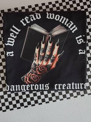 A well read woman is a dangerous creature 🖤 #graphictees #BookTok #oversizedtee #alttiktok #revolution #altoutfits #boutique #witchy #plussizefashion #gothgirl #grungeaesthetic #bookish 