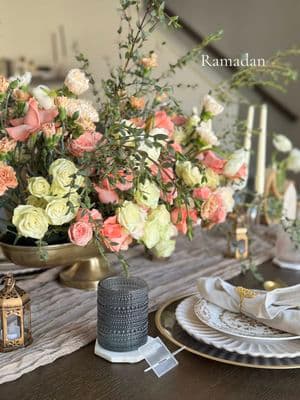 My Ramadan tablescape this year 🤍✨ Floral arrangement: Me Dress: @fashfocused  Floral plates, napkin rings, cups, lanterns, runner, crescent flower holder: @Amazon (link in bio) Gold charger, vase, utensils: @Hobby Lobby  Pink plates: @H&M  Date holder,  crescent candle holder: Temu Ramadan Mubarak sign: @The Craftghan  #Ramadan #RamadanMubarak #ramadan2025 #ramadantablescape #hostingramadan #hosting #tablescape 