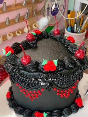 This is a beautiful black cake with some red details that gave it a very elegant look!! #Cake #Cakes #Buttercream #ButtercreamCake #BirthdayCake #Birthday #BlackCake #GlitterCherries #GlitterCake #WiltonPipingTips #ButtercreamPiping #CakeDecorating #CakeCakeDecorator #CakeCakeTutorial #CakeLady #VintageHeartCake #HeartCake #Vintage ##Magally##MagallyCakes